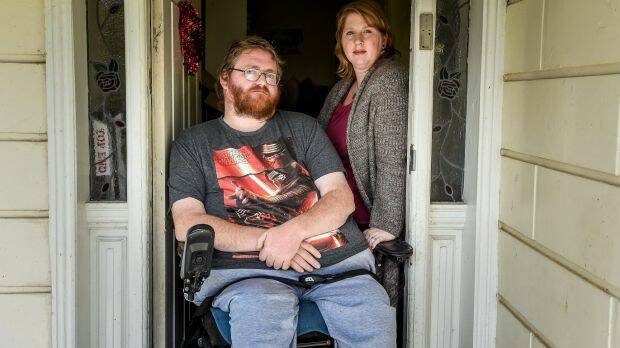 Shane Barnbrook, with wife Sarah, is suing two hospitals for negligent care that left him a quadriplegic. Photo: Justin McManus