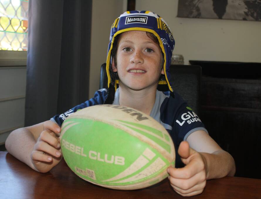 PROUD AS PUNCH: Cohen Jarrett with the headgear worn by the great man himself, Johnathan Thurston.
