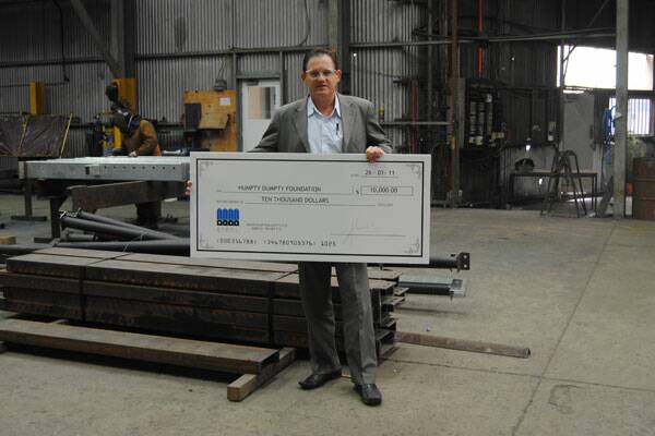 • DONATION: Mass Steel General Manager David Campbell has seen production at the former DME Kermac Engineering premises double over the last three months, and plans to further expand the facility. He’s pictured here with a $10,000 cheque from the company to the Humpty Dumpty Foundation, which helps children with cancer.