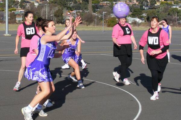 GOOD GAME: U/17’s Olivia Hannan takes a good feed into the circle while being put under pressure the Catastrophies’ Maree Blake- Dyke