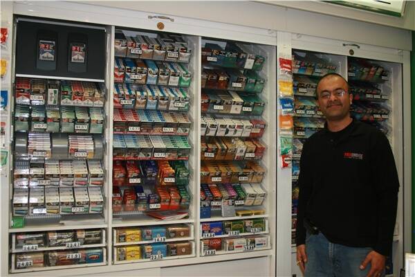 Centro Goulburn's Free-Choice Tobacconist manager Dipak Kumar, with the display he could soon be forced to remove by NSW law.