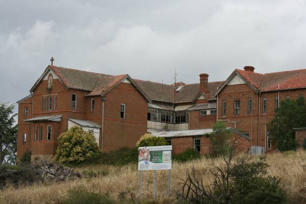 TRANSFORMATION?: Signs pitching retirement village land sales around the former St John’s Orphanage have been posted in the last few weeks. Developer Peter Madew has outlined plans for the project, the site’s clean up and the main building’s restoration