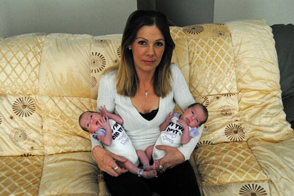 Newborn twins Grace Stella (left) and Willow Angel (right), with rare identical DNA, and their mother Crystal Lepre.