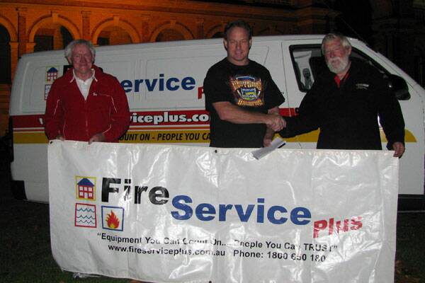SPEEDWAY SPECTACULAR: Fire Service Plus manager Kerry Bensley and director Steve Caunt with Goulburn Speedway President Brian McAlister.