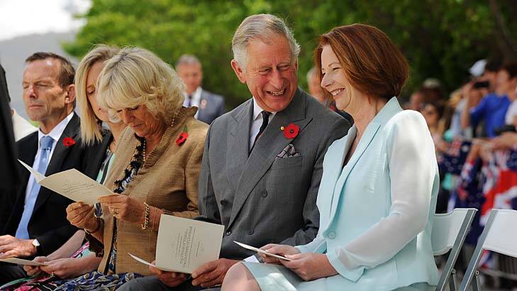 Art of resilience ... the duchess studies her program while Charles engages Julia Gillard.