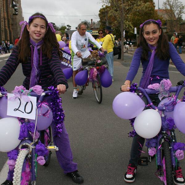 LILAC COLOUR: Isabella Smith and Ashley price of Goulburn swung into Lilac Festival spirit with their decorated bikes in the Lilac Time Procession.