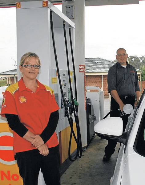 CHOICE COUNTS: South Goulburn Shell service station manager Mandy Connor says customers are specifically asking for unleaded fuel. The station still supplies it, along with E10 petrol. Mrs Connor says it’s important to give people choice. In the background, Canberra man David Nisbett fills up.  