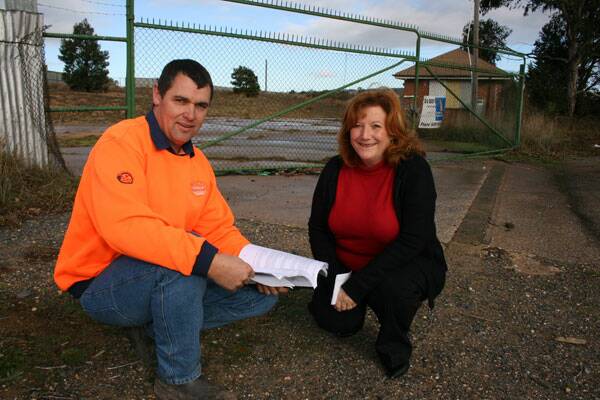 ON TRACK: Denrith Pty Ltd director Andy Divall and Endeavour Industries CEO Margaret Cunningham perused plans nearly two years ago for a modern recycling facility in Bridge St, off the Sydney Rd at North Goulburn.