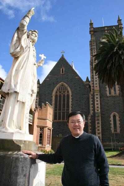 • FAITH MOVE: Assistant priest at Mary Queen of Apostles Parish Fr Michael Lim says Goulburn has a strong Catholic faith and is justly proud of its heritage. He stands next to the statue of St Francis Xavier, the patron saint of Singapore, the city-state of his birth, and Australia.