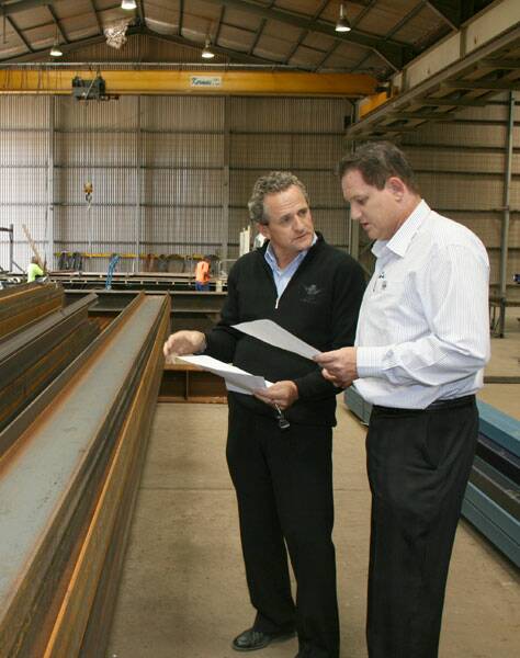 CHANGING TIMES: DME Kermac Engineering owner and managing director Don Earle (left) talks terms with Mass Steel general manager David Campbell, whose company will lease a large part of the north Goulburn facility.
