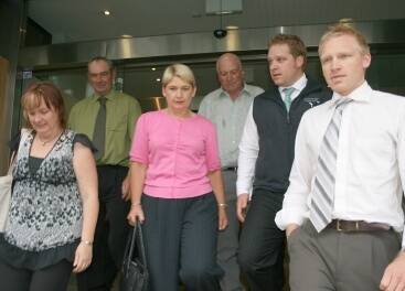 SEEKING ANSWERS: The families of the late Neville Smith and John Guthrie emerged from Glebe Coroner's Court on Friday after an exhausting two weeks of evidence into the plane crash that killed the men. L-r: Mr Guthrie's children Melissa Gray and Mark Guthrie, Carol Smith, Mr Smith's brother Harvey and Neville's sons, Brad and Ben.