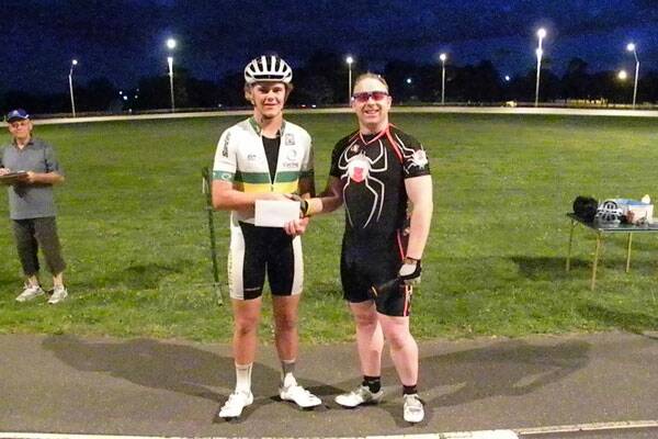 HELPING HAND: Goulburn Cycle Club president Adam Lambert presents Mark Gibson with some financial assistance towards his trip to New Caledonia.