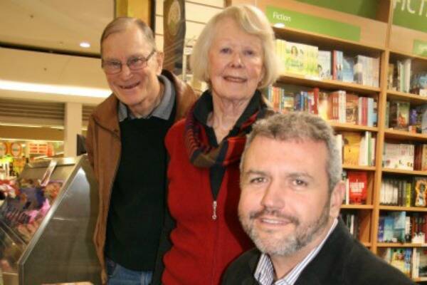 HOME AGAIN: Author and former Goulburn man Greg Barron caught up with family friends Jenny and Dr Michael Burgess at the signing of his first published work, Rotten Gods at Town and Country books on Sunday. The Burgess’ son Andrew was a friend of Mr Barron’s.