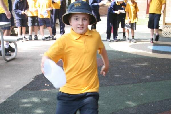 RECYCLING RACE: Windellama Public School’s Lachlan Mireylees competes for the ‘Greenies’ team during National Recycling Week activities last Tuesday.