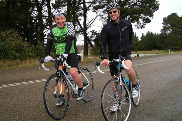 Goulburn Mulwaree Council general manager Chris Berry and Goulburn Post editor Gerard Walsh (both Masters riders), pictured on Windellama Road during practice for the Grand Prix Challenge last year.