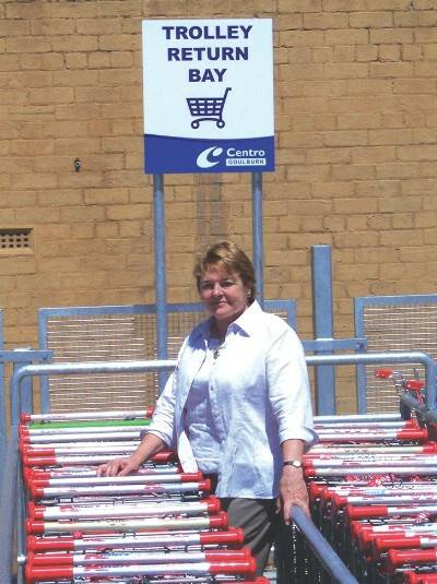 ON TRACK: The project manager for Trolley Tracker, Lyn Hall, with a collection of trolleys "all doing the right thing - waiting in a trolley bay for a responsible customer".