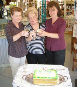 21 TODAY: Staff members (l-r) Jenny Law, Pat Blay and Donna Boyt toasted the Big Merino's 21st birthday on Wednesday. The birthday will be the last at the present site before 'Rambo' moves to the Mobil Service Centre further along Hume St.