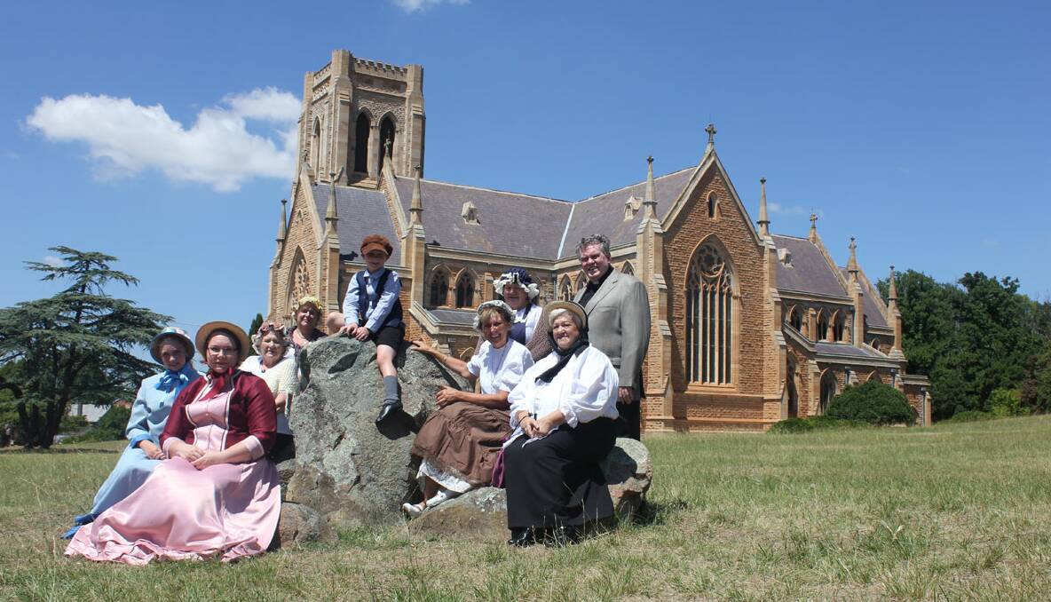 BLAST FROM THE PAST: Local costume designer Linda Sparks and her two children Laura and Mitchell joined 150th Birthday Committee members Pat Spilsbury, Sandra Nadan, Lynn Mortimer, Carol James and Jean Townsend as well as the Dean of St Saviour’s Cathedral Phillip Saunders. Photo: Tom Sebo. 