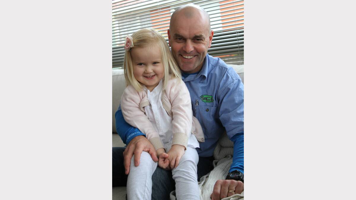 Tim Blair with three-year-old Charlotte Rataj, who has acute lymphoblastic leukaemia. Mr Blair will run from Launceston to Devonport on August 25 to raise funds for her treatment. Picture: Tony Cross.