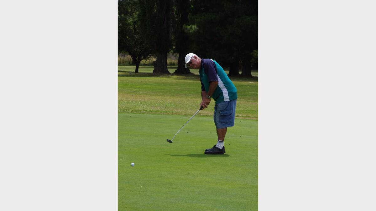 LAST HOLE: Bob Todkill takes aim at the 18th pin during his round of Golf with the RSL Social yesterday