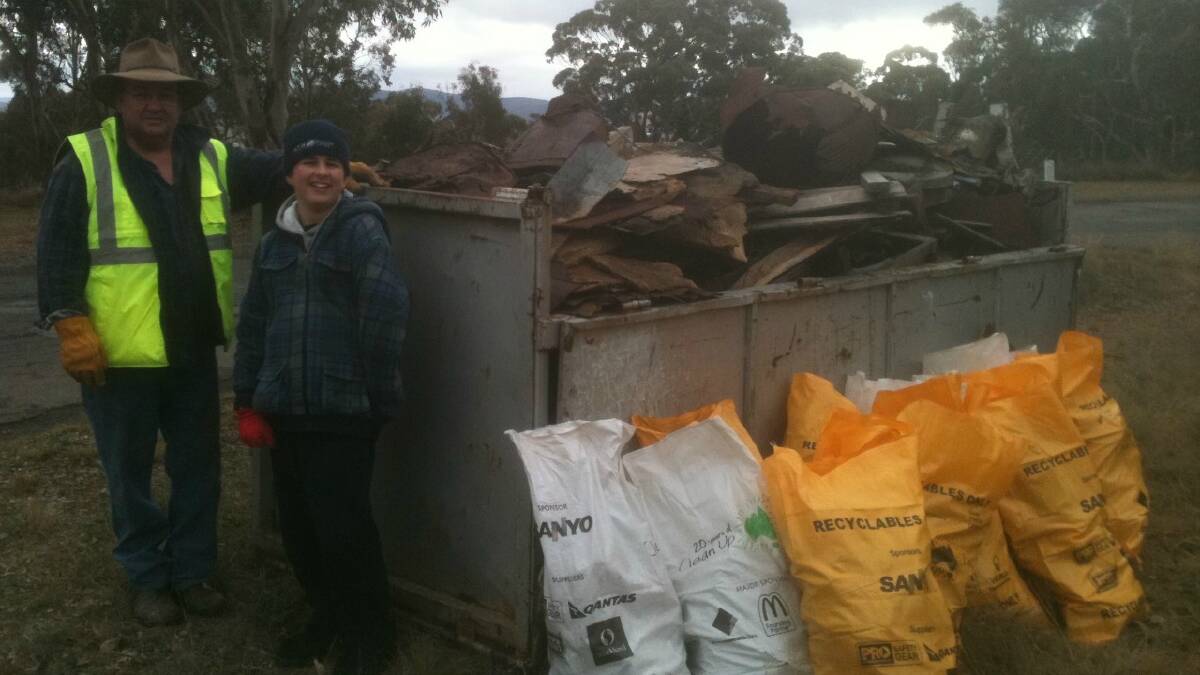 BIG LOAD: West Goulburn Bushland Group Vice-President Tim Street and enthusiastic helper Lloyd Warren, admiring their handiwork after the cleanup of the area recently.