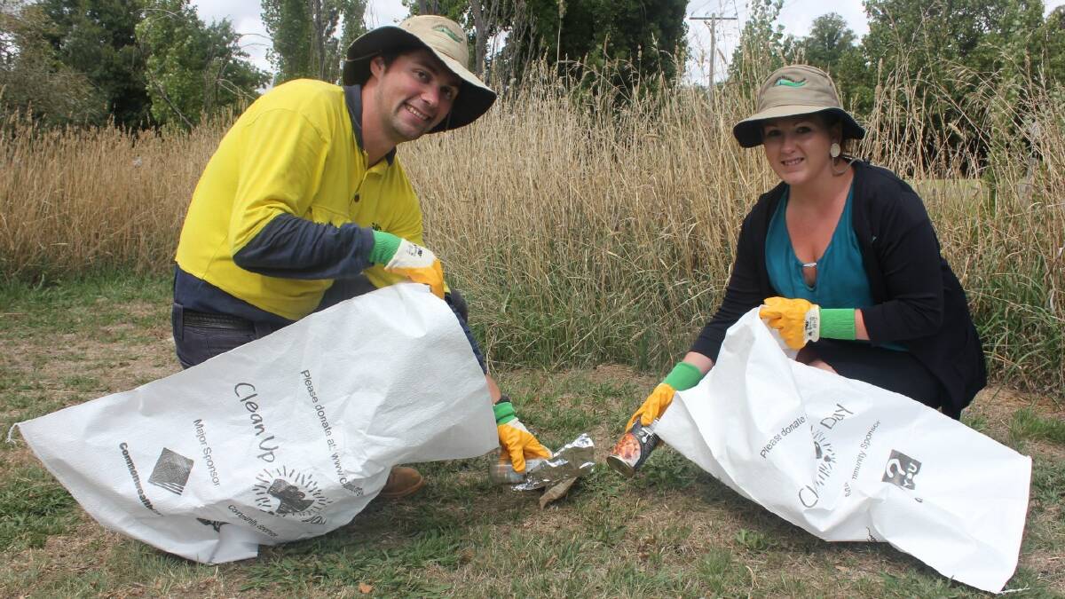 CLEANING UP: Council Parks and Recreation employees Michael Brooker and Bianca Wilson tidy up an area around the walking track near the Blackshaw Rd site where Goulburn’s Clean-Up Australia Day activities will take place.