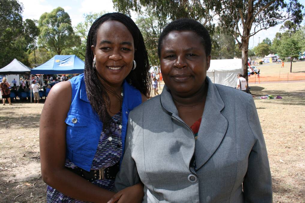 BIG MOMENT: Zimbabwean-born Irene Katumba became an Australian citizen with two of her daughters, Shamiso and Sharon on Saturday. Her other daughter, Shingirai Katumba (left) travelled from Alice Springs for the celebrations.