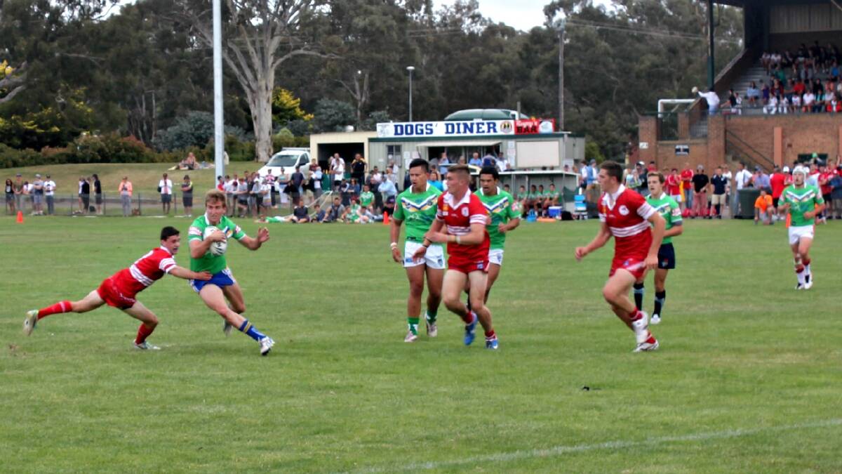  Crookwell’s Lachlan Croker makes life difficult for the Illawarra defenders in the under 18s trials at the Goulburn Workers Oval on Saturday. Photo: Chris Clarke 