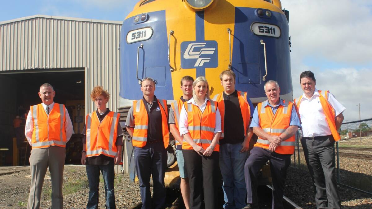ECONOMY BOOST: Four new apprentices have started work at the Chicago Freight Car Leasing Australia (CFCLA) workshops on Braidwood Rd. Dale Tiyce (left), Jeremy Hunt, Matthew Scott and David Moxon are pictured with Mayor Geoff Kettle, Australian Business Apprenticeships Centre Industry Training Consultant Kelly Mulligan, John Rawle from Southern Tablelands Group Training and CFCLA Workshop Manager Mick Cooper at the announcement on Wednesday morning.