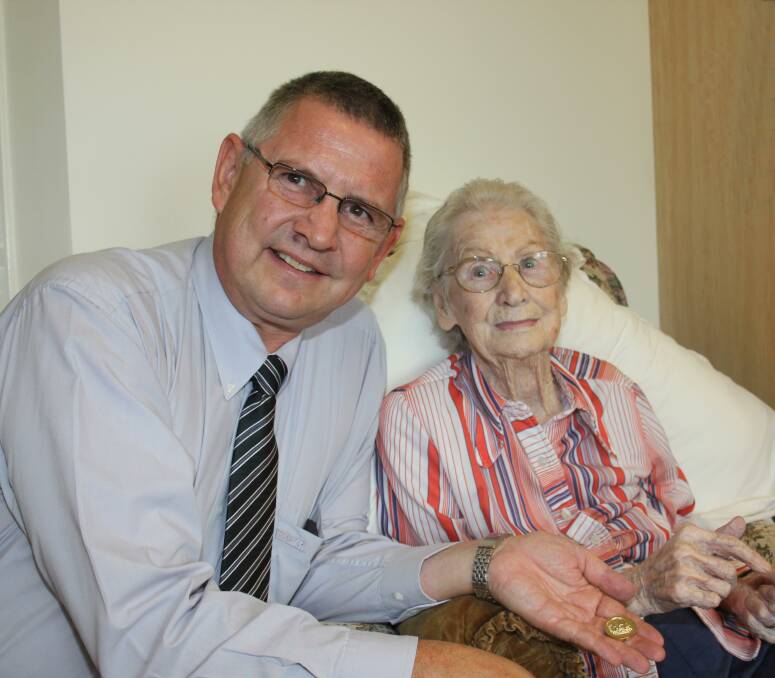 SPENDING TIME: Mayor Geoff Kettle shows his mum Alma the 150th Birthday Commemorative Coin that she will receive.  