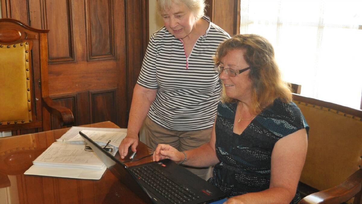  CATALOGUING HISTORY: Daphne Penalver and Lynette Miller display the working progress that is the Historical Society’s cataloguing system.