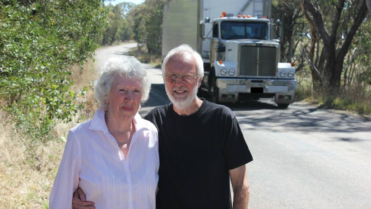  CONCERNED: Range Rd residents Allan and Renira Reed are concerned about the speed of trucks along their peaceful stretch of road. They are worried that a child or car driver could be severely injured or killed by the speeding trucks.  (truck pictured was not speeding).