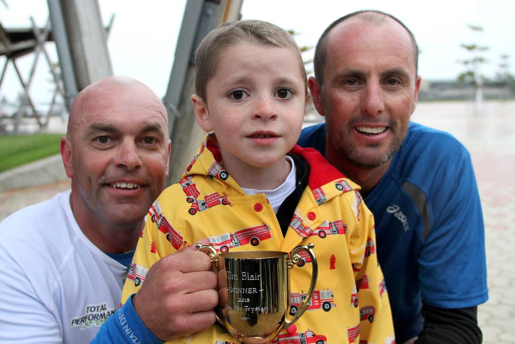 Tim Blair, Trystan Stephens and Shane Taylor with the trophy Trystan bought for Tim. Picture: Stuart Wilson.