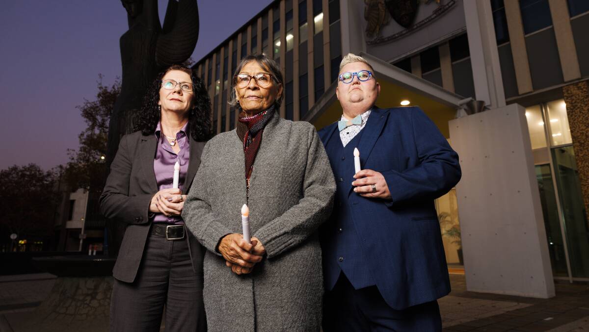 Children and Young People Commissioner Jodie Griffiths-Cook, Aunty Violet Sheridan and DVCS CEO Sue Webeck at a candlelight vigil on Wednesday. Picture by Keegan Carroll