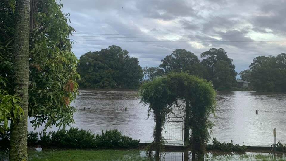 The veiw from Sue and Brett McGinn's property on Belmore River where the river has come across the banks onto the road, which is now under water. Photo: Sue McGinn