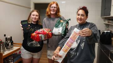 Meet the housemates who save on groceries by bulk-buying. They are, from left, Tamara Stewart, Charlie Seidel and Nadia Paige. Picture by Sylvia Liber