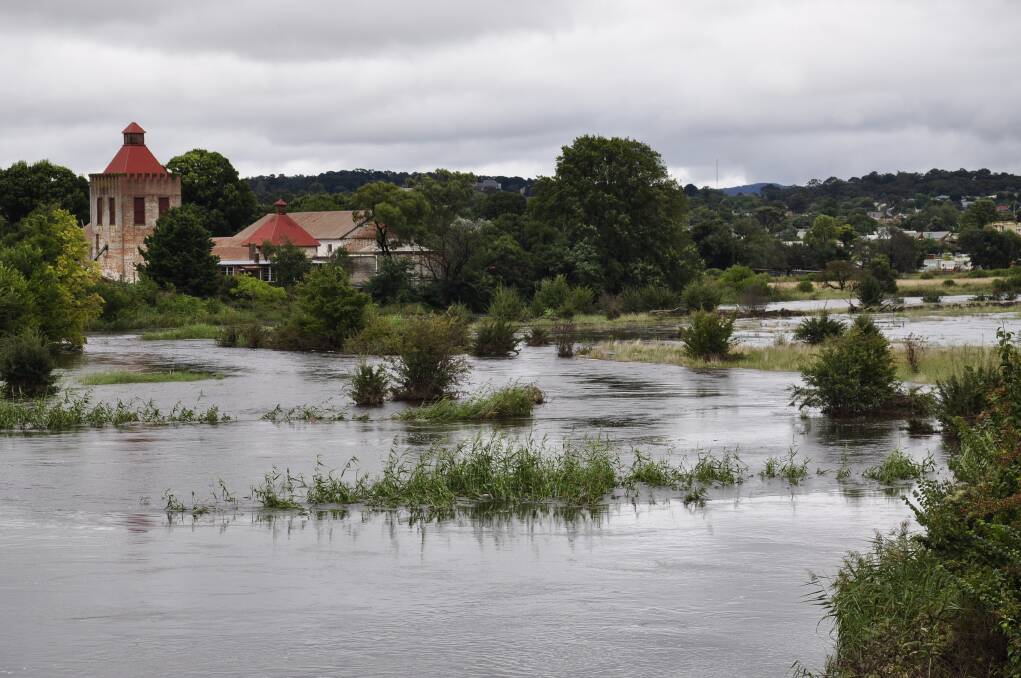 A swollen Mulwaree Ponds on Sunday following Saturday's deluge. The Old Goulburn Brewery is in the background. Picture: Louise Thrower