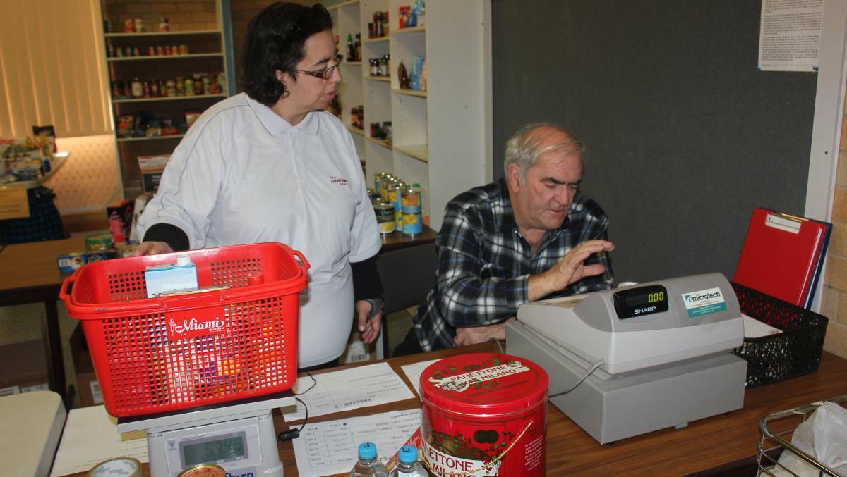 Salvos staff are on hand to assist those who need help at the food pantry. Photo: file
