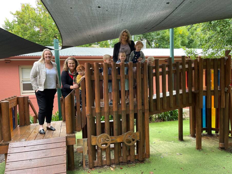 PLAY TIME: SDN Head of Services Jodie Lebrook, Member for Goulburn Wendy Tuckerman, SDN Lady McKell Director Anna Lamarra with children at SDN Lady McKell Goulburn. Picture: supplied