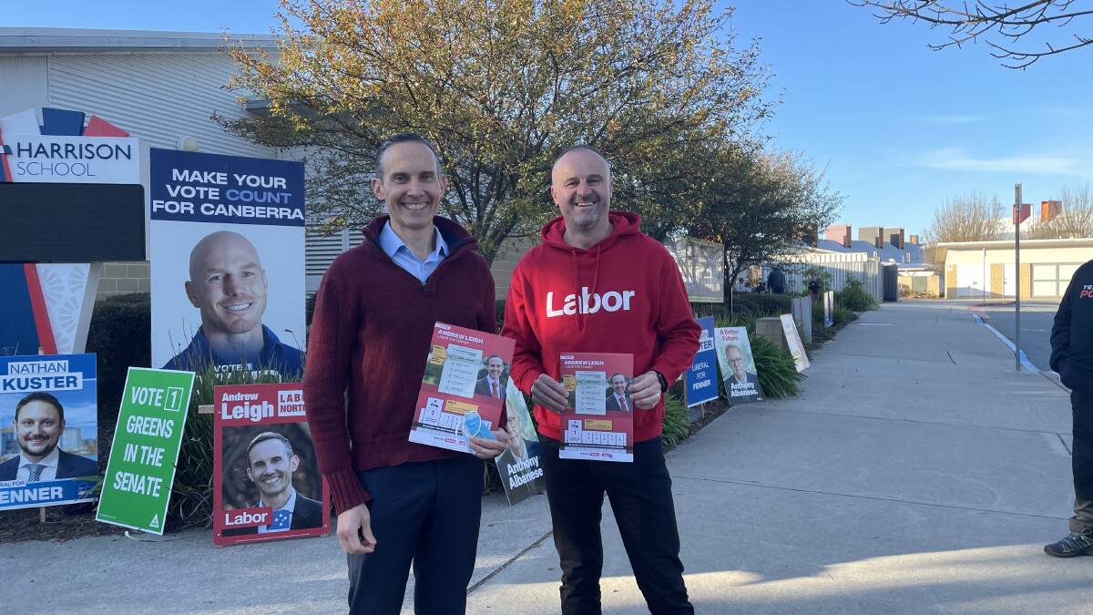 Andrew Leigh about to vote while being supported by Andrew Barr. Picture: Olivia Ireland