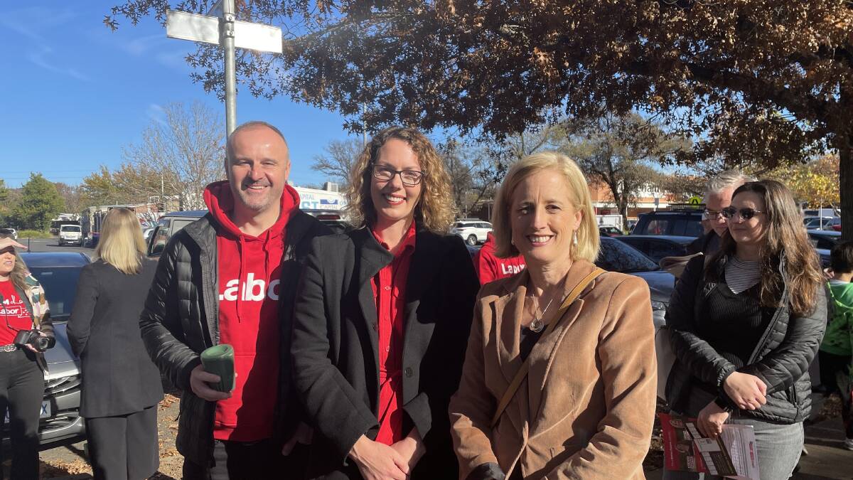 Chief Minister Andrew Barr, Alicia Payne and Katy Gallagher lining up to vote at Lyneham Primary School. Picture: Olivia Ireland