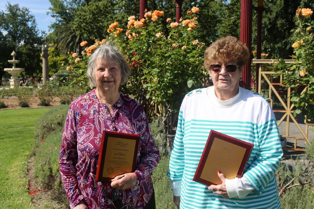 Moira McGinity (L) with Margaret ONeill OAM (R) receiving Goulburn Mulwaree Awards at the celebration of Goulburn's 159th birthday in Belmore Park. Photo: Goulburn Mulwaree Council.
