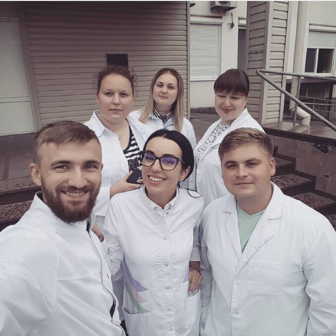 Natalia Peker's nephew Roman Zavjalov (front left) with his colleagues in Ukraine. Picture supplied via Instagram