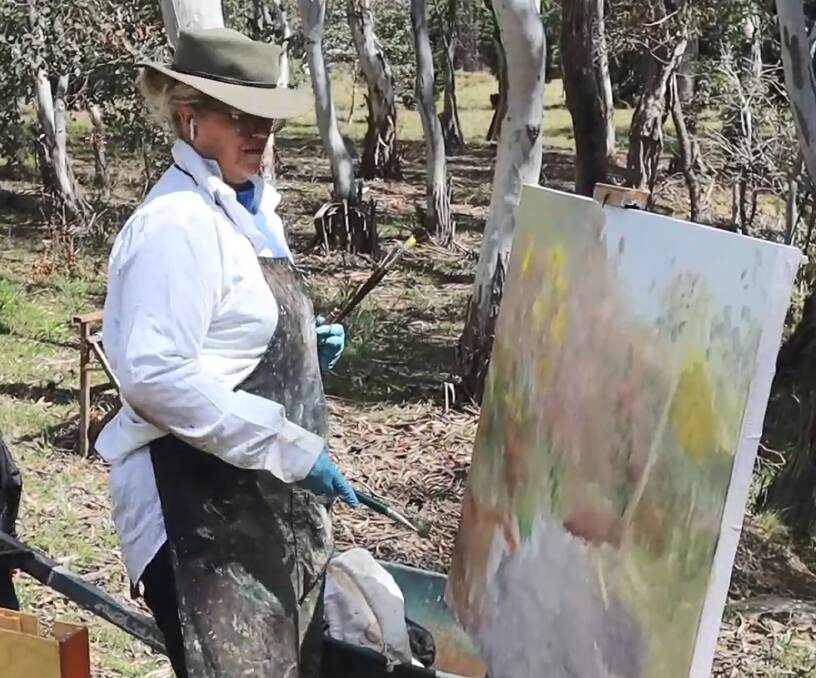 Sylvie Carter painting in the creek on her Wamboin property. Picture supplied