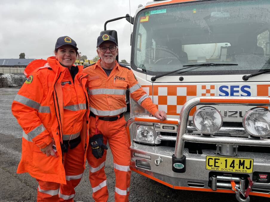 SES volunteer Natasha Norris and commander Rob Bell are warning residents to prepare for a rain deluge. Picture by Sophie Bennett