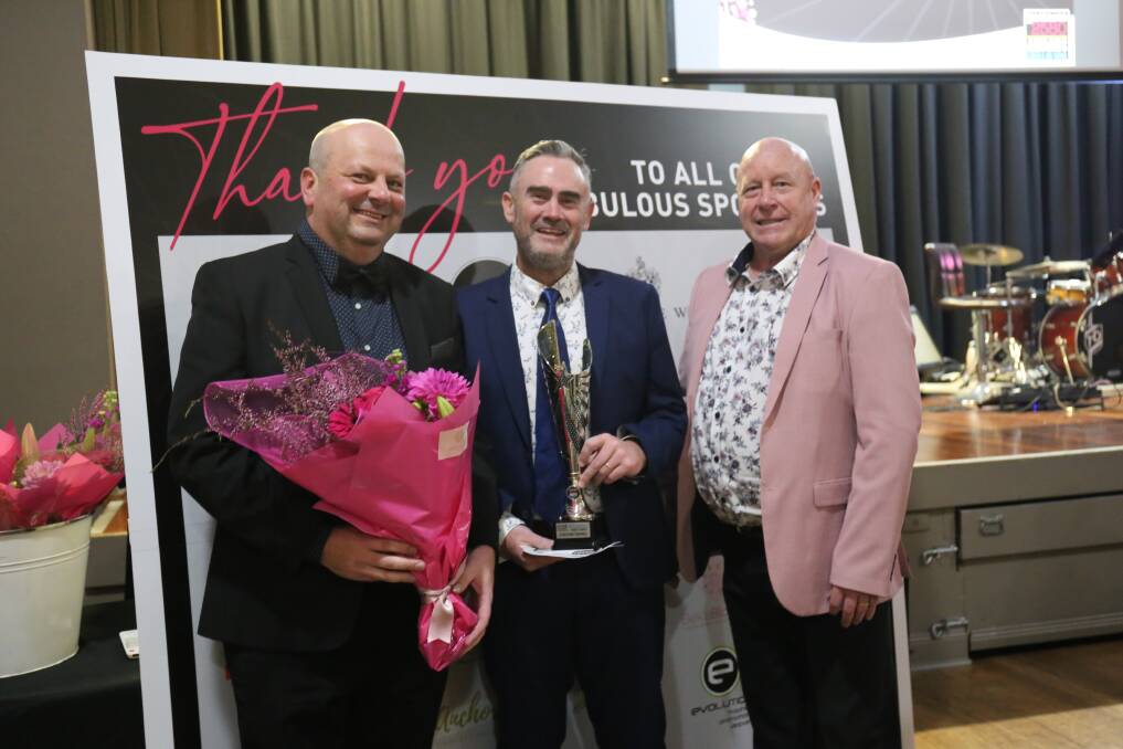 People's Choice award winners Craig Norris and Brandon Doggett of Evolution Trophies with Goulburn Chamber of Commerce president Darrell Weekes. Photo: Sophie Bennett.