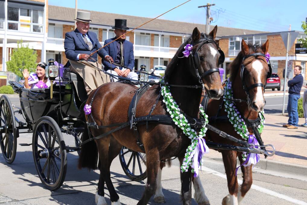 The 2022 Lilac Queen Felicity Apps leading the Lilac City Festival Parade in a horse-drawn carriage. Picture by Sophie Bennett