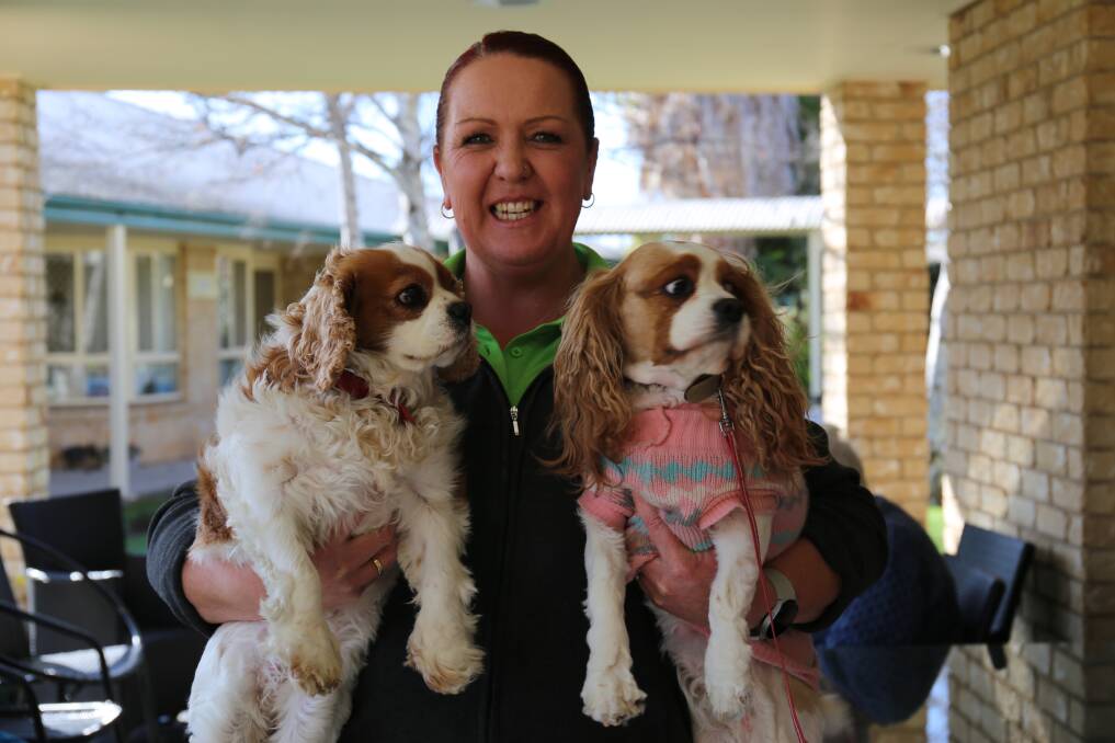 Community manager Nicole Ingram with dogs Poppy and Lilly Anne Gill. Photo by Sophie Bennett.
