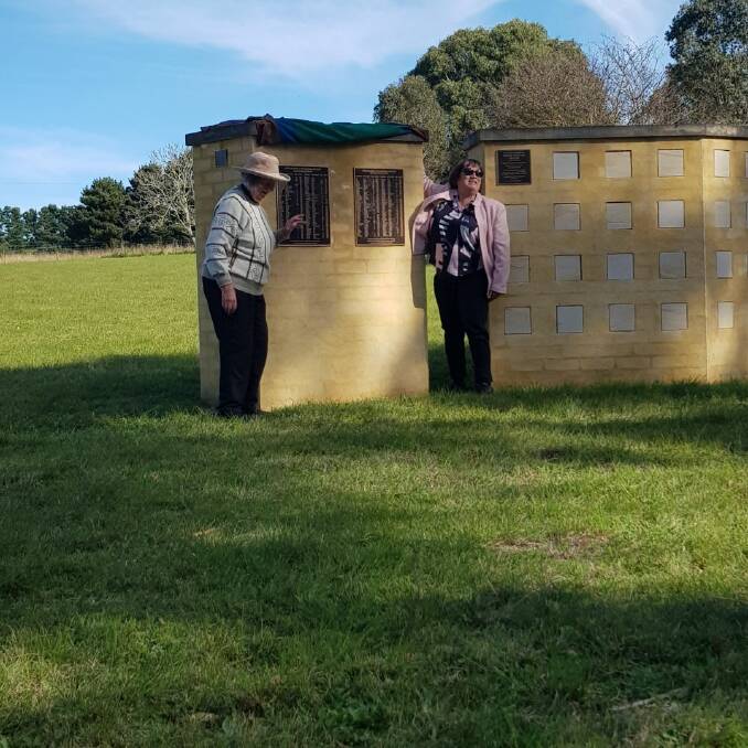 Moira McGinity and Julie Young unveiling the plaques listing the 200 names of those resting in the Bungonia Cemetery whose grave sites are unknown. Photo: Supplied.