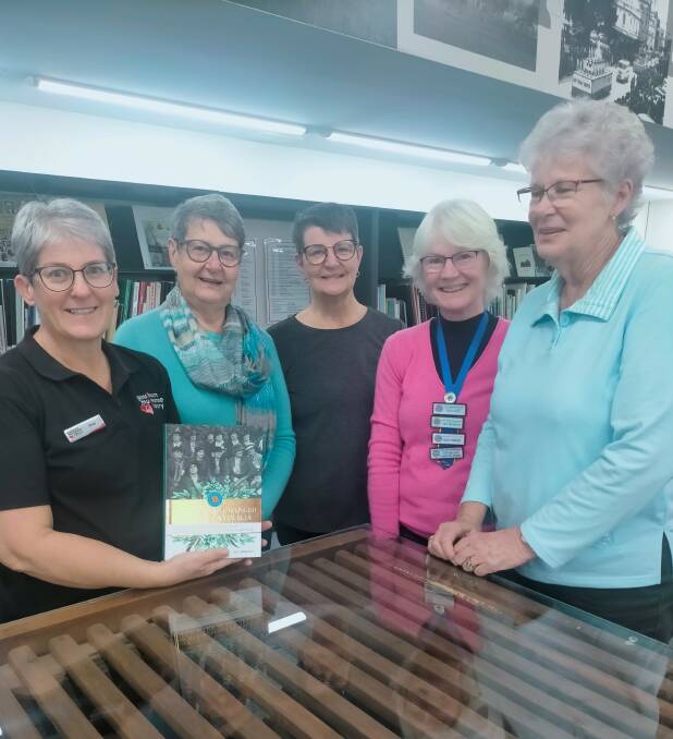 CWA presents book to Goulburn Mulwaree Library. Peta Luck from the local studies team at the library with representatives of CWA Goulburn Evening Branch Karen Wilson (secretary), Narelle Kennedy (publicity officer) Karen Pavey (vice president) and Marilyn Manfred (president). Photo: Supplied.